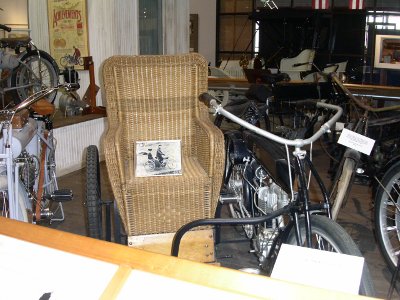 [Wicker chair attached to a motorcycle.]